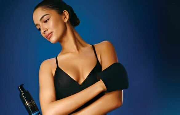 Woman applying self tanner with Bondi Sands tan application mitt