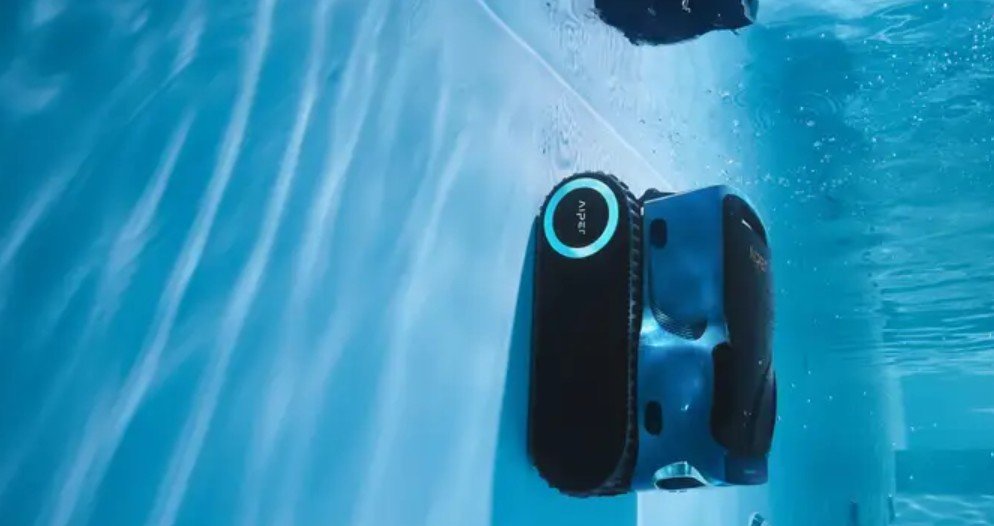 Aiper Scuba X1 Pro Max robotic pool cleaner sitting on the edge of my pool